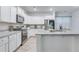 Modern kitchen featuring white cabinets, granite countertops, and stainless steel appliances at 120 Loon Dr, Summerville, SC 29483