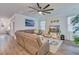 Bright living room features a comfortable sectional sofa, ceiling fan, and decor at 120 Loon Dr, Summerville, SC 29483