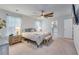 Spacious main bedroom with a ceiling fan, king-sized bed, and attached bath at 120 Loon Dr, Summerville, SC 29483