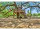 Magnificent treehouse with a slide and multiple levels, perfect for outdoor fun and adventure at 120 Loon Dr, Summerville, SC 29483