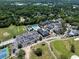 Aerial view featuring neighborhood amenities, including a pool, clubhouse, golf course, and tennis courts at 1218 Chersonese Round, Mount Pleasant, SC 29464