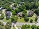 An aerial view of a home surrounded by mature trees and lush landscaping at 1218 Chersonese Round, Mount Pleasant, SC 29464