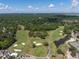 An aerial view of a stunning golf course surrounded by lush greenery, offering a picturesque landscape at 1218 Chersonese Round, Mount Pleasant, SC 29464