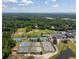 Aerial view of community tennis courts, golf, pool, clubhouse, and parking area at 1218 Chersonese Round, Mount Pleasant, SC 29464