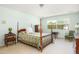 Bedroom featuring light blue walls, a four poster bed, and plenty of natural light at 1218 Chersonese Round, Mount Pleasant, SC 29464
