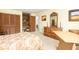 Bedroom featuring a bed with patterned bedding, wooden dresser, and view to ensuite bathroom at 1218 Chersonese Round, Mount Pleasant, SC 29464