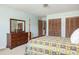 Spacious bedroom with light blue walls, wooden furniture, and closet at 1218 Chersonese Round, Mount Pleasant, SC 29464
