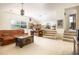 A spacious bonus room with carpet, a comfortable leather couch, and lots of natural light at 1218 Chersonese Round, Mount Pleasant, SC 29464