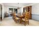 Traditional dining room featuring wood table, china cabinet, and floral wallpaper with backyard view at 1218 Chersonese Round, Mount Pleasant, SC 29464