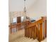 A foyer with a high ceiling features a wooden staircase, pendant lighting and a tiled entry at 1218 Chersonese Round, Mount Pleasant, SC 29464