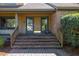 Welcoming front entrance with brick steps and a covered porch, adding curb appeal to the home at 1218 Chersonese Round, Mount Pleasant, SC 29464