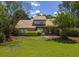 Charming home with lush green lawn, mature trees, and well-maintained landscaping, creating great curb appeal at 1218 Chersonese Round, Mount Pleasant, SC 29464