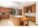 Kitchen featuring center island with countertop, wooden cabinets, and an adjacent eating nook at 1218 Chersonese Round, Mount Pleasant, SC 29464