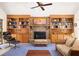 Bright living room showcasing a brick fireplace, built-in shelving, and comfortable seating and decor at 1218 Chersonese Round, Mount Pleasant, SC 29464