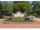 A beautifully landscaped neighborhood entrance with colorful flowers and a welcoming sign at 1218 Chersonese Round, Mount Pleasant, SC 29464