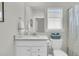 Bathroom with a single sink vanity with marble countertop, toilet, and window at 1273 Locals St, Summerville, SC 29485