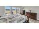 Comfortable bedroom with dressers, and large windows offering views of the water at 1273 Locals St, Summerville, SC 29485