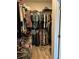 Walk-in closet with wire shelving and rods, packed with clothes and accessories at 1273 Locals St, Summerville, SC 29485