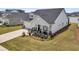 This home features a perfectly manicured lawn, rocking-chair front porch, and attached garage at 1273 Locals St, Summerville, SC 29485