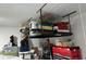 Ceiling storage rack in garage with bins, boxes and other items stored for convenience at 1273 Locals St, Summerville, SC 29485