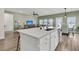 Modern kitchen island with a breakfast bar, updated appliances, and an open layout to the living area at 1273 Locals St, Summerville, SC 29485