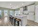 Modern kitchen with a large island, breakfast bar, stainless steel appliances, and pendant lighting at 1273 Locals St, Summerville, SC 29485