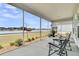 Cozy screened porch with comfortable seating and a beautiful view of the lake at 1273 Locals St, Summerville, SC 29485