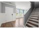 Inviting entryway with wood flooring, stairs and a white front door at 130 Stagecoach Ave, Summerville, SC 29486