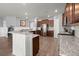 Modern kitchen featuring stainless steel appliances, granite countertops, and hardwood floors at 130 Stagecoach Ave, Summerville, SC 29486