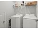 Well-lit laundry room featuring modern appliances and storage shelves at 130 Stagecoach Ave, Summerville, SC 29486