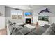 Cozy living room with a fireplace, large sofa, and coastal decor at 130 Stagecoach Ave, Summerville, SC 29486