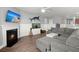 Spacious living room with a fireplace, mounted TV, and nautical themed decoration at 130 Stagecoach Ave, Summerville, SC 29486