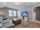 Cozy living room featuring a comfortable sofa, a wooden coffee table, and a mounted television at 130 Stagecoach Ave, Summerville, SC 29486