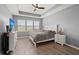 Calm main bedroom with tray ceiling, large windows, and modern decor at 130 Stagecoach Ave, Summerville, SC 29486