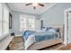 Bright bedroom with a large bed, ceiling fan, and natural light from the window at 1348 Seaside Plantation Dr, Charleston, SC 29412