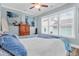 Comfortable bedroom featuring a large bed, ceiling fan, and natural light from the window at 1348 Seaside Plantation Dr, Charleston, SC 29412