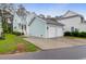 Beautiful home with a detached two-car garage and a well-manicured lawn at 1348 Seaside Plantation Dr, Charleston, SC 29412
