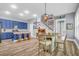 Well-lit kitchen featuring an island with wooden stools and a cozy dining area, ideal for gatherings at 1348 Seaside Plantation Dr, Charleston, SC 29412