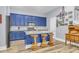 Well-appointed kitchen with blue cabinets, granite countertops, stainless appliances, and a functional layout at 1348 Seaside Plantation Dr, Charleston, SC 29412