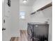 Bright laundry room with modern appliances, white walls, and tiled floors at 1348 Seaside Plantation Dr, Charleston, SC 29412