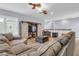 Inviting living room with comfortable seating, a large sofa, and a entertainment center at 1348 Seaside Plantation Dr, Charleston, SC 29412