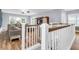 Open living room with cozy seating, an entertainment center, and wood floors at 1348 Seaside Plantation Dr, Charleston, SC 29412