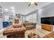 Bright and open living space with hardwood floors, leather sofas, and a kitchen island at 1348 Seaside Plantation Dr, Charleston, SC 29412