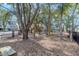 Community playground area with swings and climbing structure, surrounded by mature trees at 1348 Seaside Plantation Dr, Charleston, SC 29412
