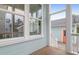 Covered porch featuring light blue siding, white trim, and view of neighboring home at 1348 Seaside Plantation Dr, Charleston, SC 29412