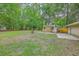 The home has a big backyard with a shed, mature trees, and a partial view of the house at 141 Larson Dr, Summerville, SC 29485