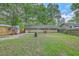 Expansive backyard with mature trees and a shed, offering a private outdoor space at 141 Larson Dr, Summerville, SC 29485