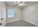 Bright bedroom with neutral paint, ceiling fan, carpeted floor, and natural light at 141 Larson Dr, Summerville, SC 29485