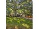 Charming brick home with a green front door and a well-manicured lawn, shaded by a large tree at 141 Larson Dr, Summerville, SC 29485