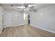 Spacious living room featuring new flooring, a ceiling fan, and a doorway that provides kitchen access at 141 Larson Dr, Summerville, SC 29485